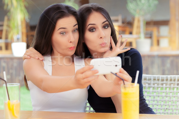 Funny Girls Taking a Selfie Together Stock photo © NicoletaIonescu