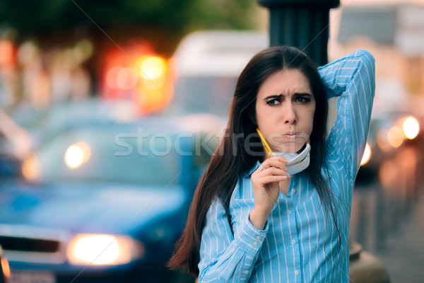 Stock photo: Woman With Respiratory Mask Out in Polluted City 