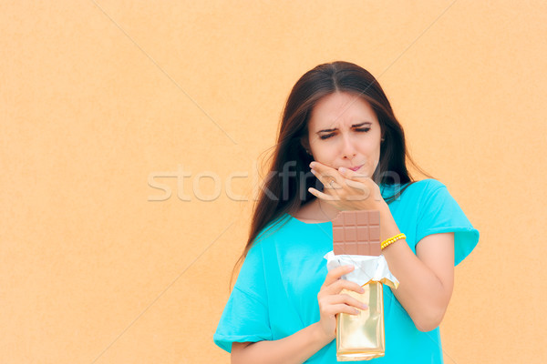 Woman Suffering Toothache After Eating Chocolate Stock photo © NicoletaIonescu