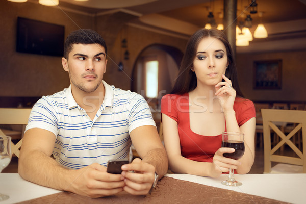 Curious Girl Spying Boyfriend on Smartphone Stock photo © NicoletaIonescu
