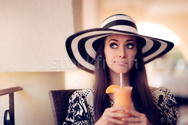 Surprised Woman With Orange Juice in a Restaurant Stock photo © NicoletaIonescu