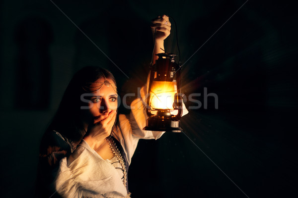 Scared Medieval Princess Holding Lantern  Stock photo © NicoletaIonescu