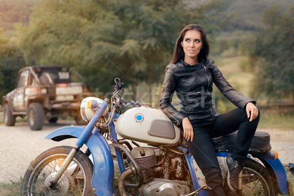 Biker Girl in Leather Jacket on Retro Motorcycle Stock photo © NicoletaIonescu
