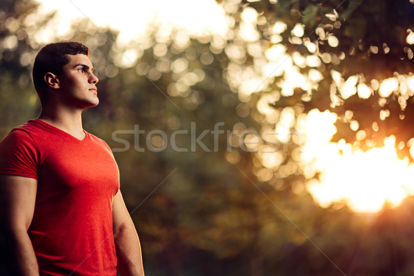 Handsome Athletic Man Standing Outside in Nature Stock photo © NicoletaIonescu