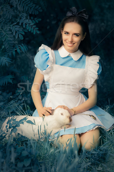Girl Costumed as Alice in Wonderland with The White Rabbit Stock photo © NicoletaIonescu