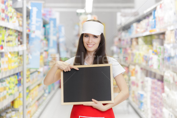 Smiling Supermarket Employee Holding a Blank Blackboard Stock photo © NicoletaIonescu