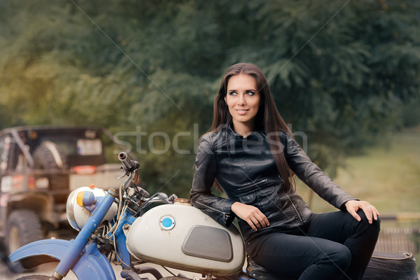 Biker Girl in Leather Jacket on Retro Motorcycle Stock photo © NicoletaIonescu