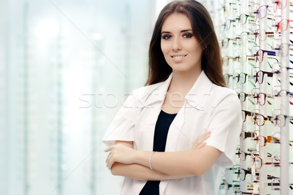 Happy Optician Standing in Optical Store Stock photo © NicoletaIonescu