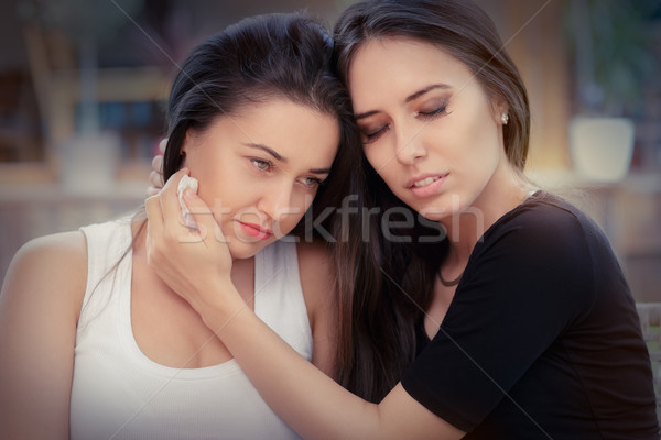 Young woman comforting tearful friend Stock photo © NicoletaIonescu