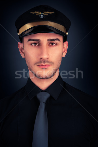 Man with Pilot Hat and Black Shirt Portrait  Stock photo © NicoletaIonescu