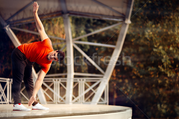 Athletic Man Stretching Before Workout Stock photo © NicoletaIonescu