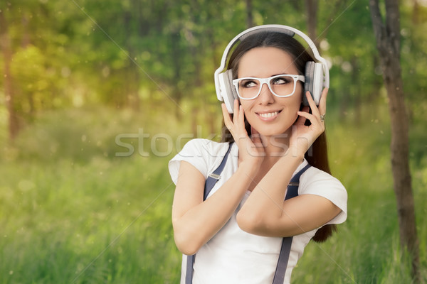 Girl with Headphones Listening to Music  Stock photo © NicoletaIonescu