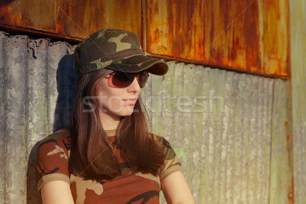 Meditative Young Woman Soldier in Camouflage Outfit Stock photo © NicoletaIonescu