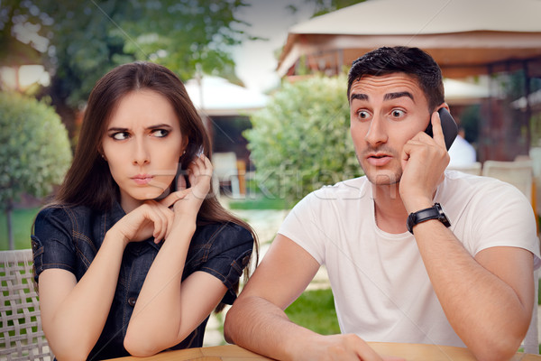 Angry Girl Listening to Her Boyfriend Talking on The Phone Stock photo © NicoletaIonescu