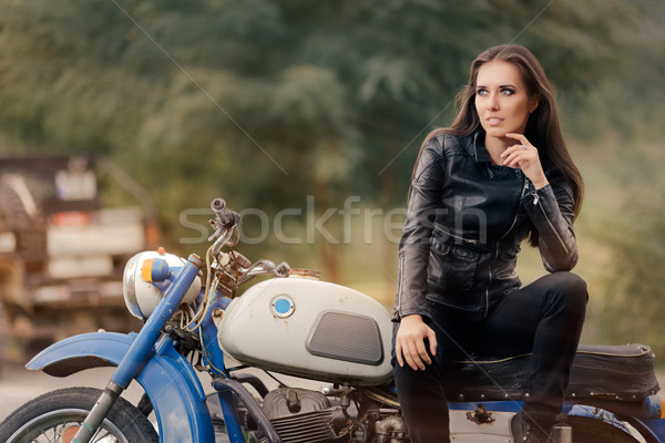 Biker Girl in Leather Jacket on Retro Motorcycle Stock photo © NicoletaIonescu