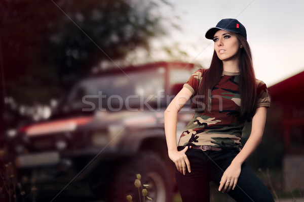 Stock photo: Female Driver in Army Outfit Next to an Off Road Car