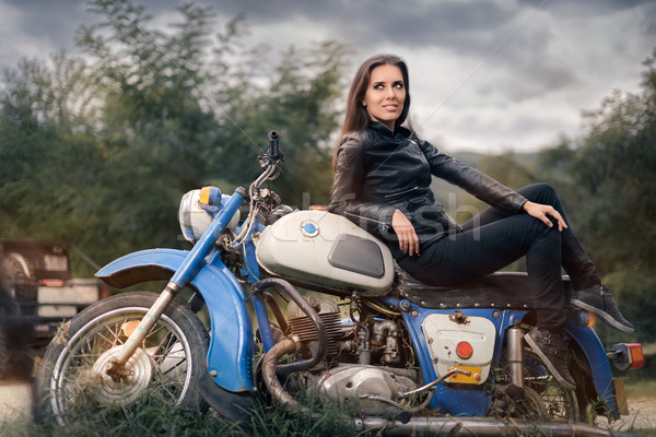 Biker Girl in Leather Jacket on Retro Motorcycle Stock photo © NicoletaIonescu