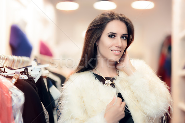 Vásárlás nő fehér szőrmebunda divat bolt Stock fotó © NicoletaIonescu