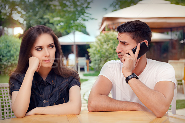Angry Girl Listening to Her Boyfriend Talking on The Phone Stock photo © NicoletaIonescu