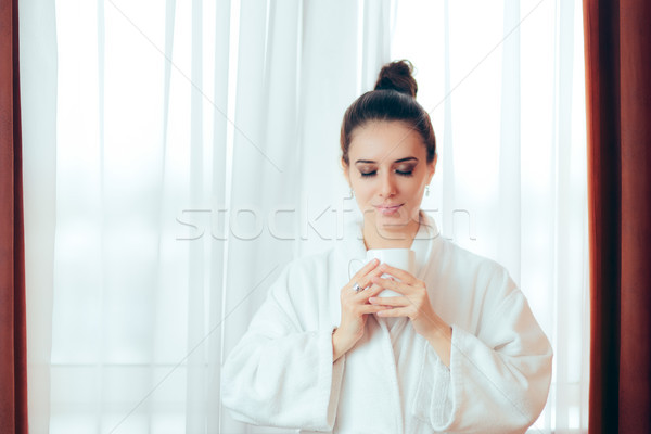 Woman in Bathrobe Starting Morning with a Cup of Coffee Stock photo © NicoletaIonescu
