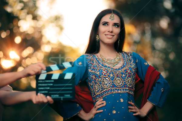 Bollywood Actress Wearing an Indian Outfit with Gold Jewelry Set Stock photo © NicoletaIonescu