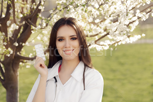 Spring Woman Doctor Smiling and Holding Pills Stock photo © NicoletaIonescu