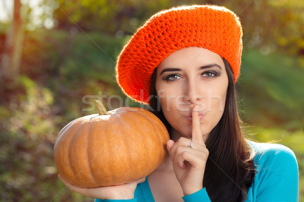 Stock photo: Woman with Pumpkin Holding a Secret