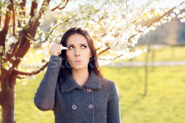 Woman with Spring Allergies Using Eye Drops Stock photo © NicoletaIonescu
