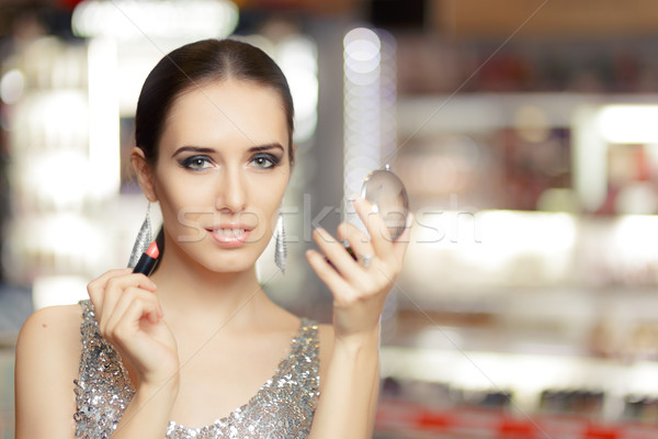 Glamour Woman with Lipstick and Make-up Mirror  Stock photo © NicoletaIonescu
