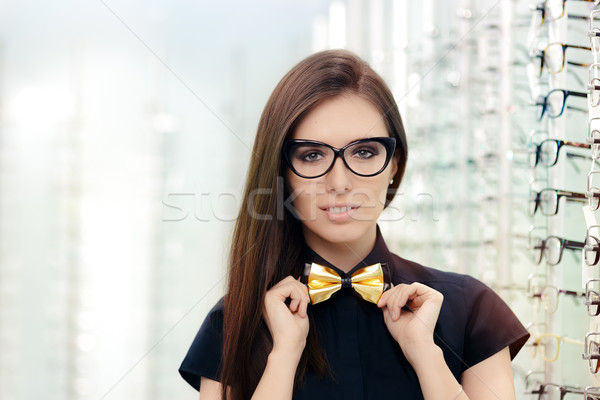 Stock photo: Elegant Bowtie Woman with Cat Eye Frame Glasses in Optical Store
