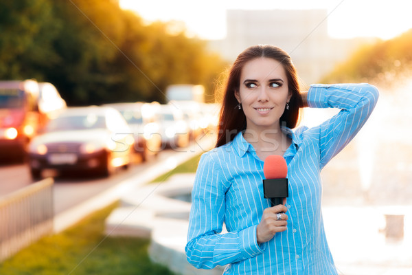 Female News Reporter on Field in Traffic  Stock photo © NicoletaIonescu