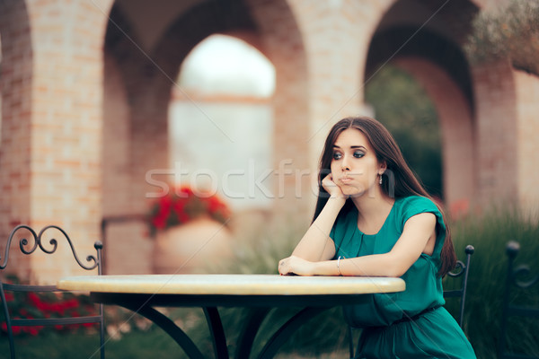 Sad Woman Being Stood Up on a Date in a Restaurant Stock photo © NicoletaIonescu
