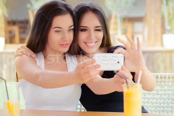 Happy Girls Taking a Selfie Together Stock photo © NicoletaIonescu