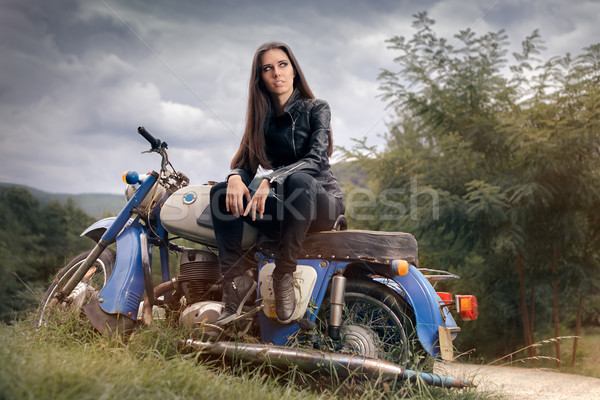 Biker Girl in Leather Jacket on Retro Motorcycle Stock photo © NicoletaIonescu