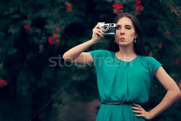 Funny Woman with Vintage Camera at a Garden Party Event Stock photo © NicoletaIonescu