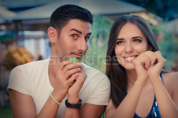 Cute Couple Having Macarons at a Restaurant Stock photo © NicoletaIonescu