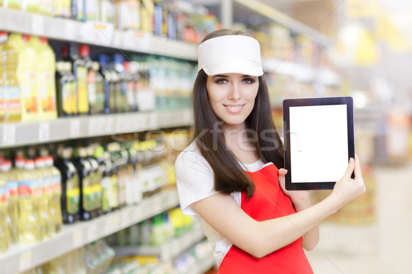 Smiling Supermarket Employee Holding a Pc Tablet Stock photo © NicoletaIonescu