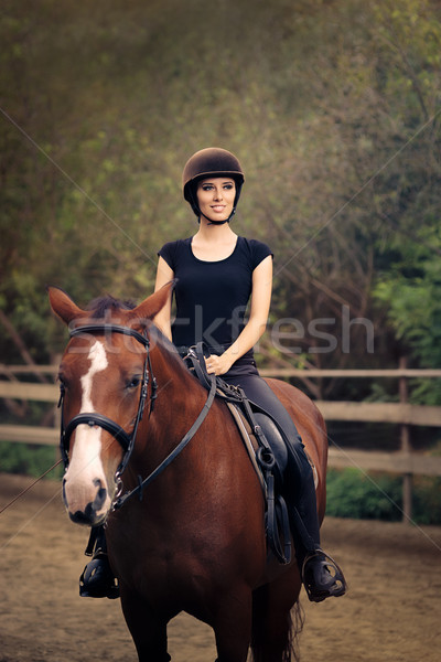 Happy Horsewoman Ridding  in a Manege Stock photo © NicoletaIonescu