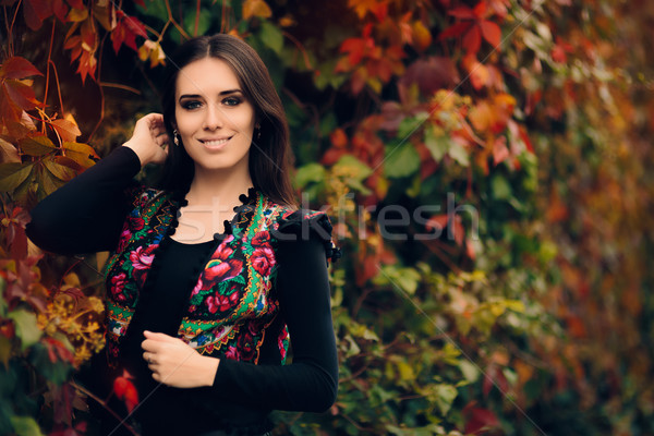 Happy Autumn Woman Wearing Colorful Ethnic Vest  Stock photo © NicoletaIonescu