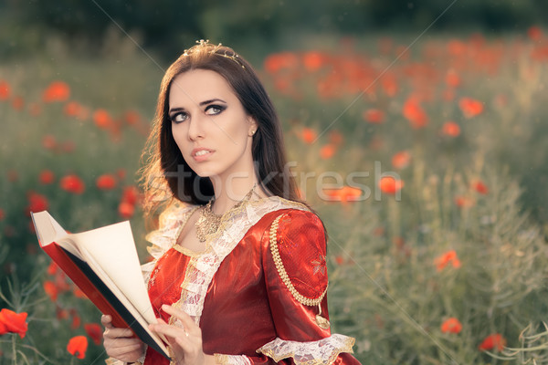 Beautiful Princess Reading a Book in Summer Floral Landscape   Stock photo © NicoletaIonescu