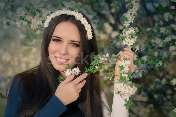 Portrait of a Happy Girl with Floral Wreath Outside Stock photo © NicoletaIonescu