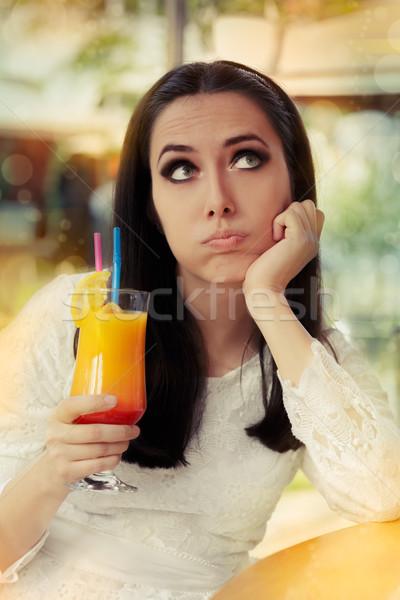 Bored Woman with Colorful Cocktail Drink Stock photo © NicoletaIonescu