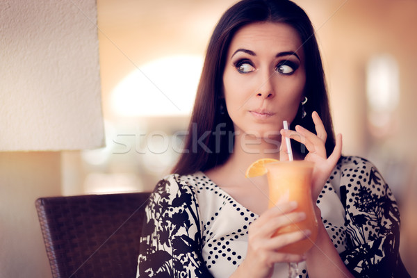 Surprised Woman With Orange Juice in a Restaurant Stock photo © NicoletaIonescu