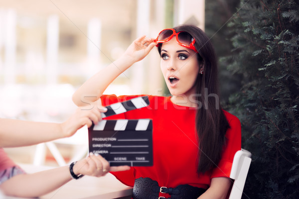 Surprised Actress with Oversized Sunglasses Shooting Movie Scene Stock photo © NicoletaIonescu