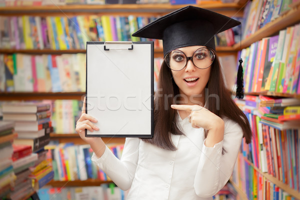 Surprised School Student Holding Blank Clipboard Stock photo © NicoletaIonescu