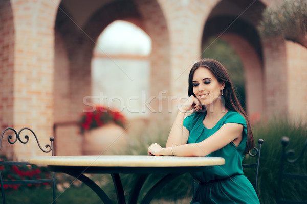 Smiling Woman Waiting for an Important Date at a Restaurant Table Stock photo © NicoletaIonescu