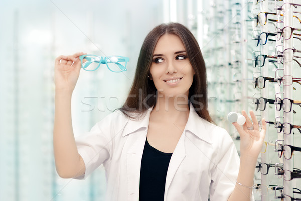 Happy Optician Choosing between Glasses and Contact Lenses Stock photo © NicoletaIonescu