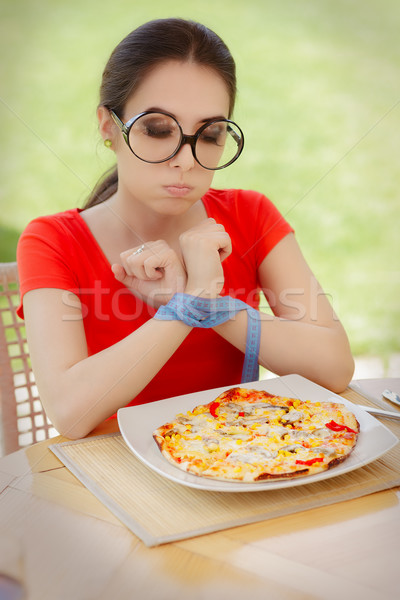 Funny Hungry Woman with Hands Tied with Measure Tape Stock photo © NicoletaIonescu