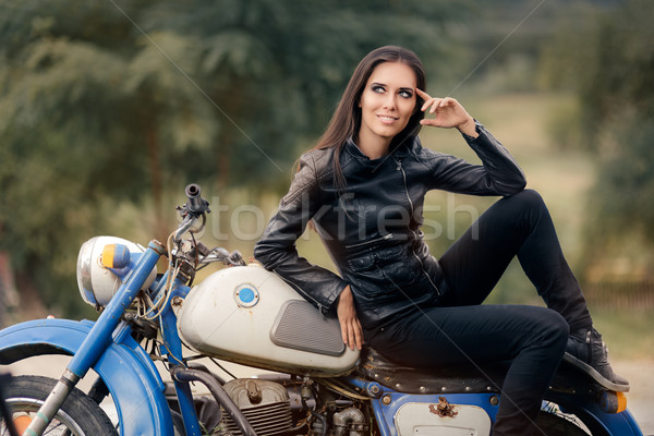 Biker Girl in Leather Jacket on Retro Motorcycle Stock photo © NicoletaIonescu