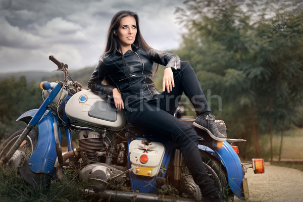 Biker Girl in Leather Jacket on Retro Motorcycle Stock photo © NicoletaIonescu